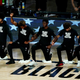 Lance Thomas of the Brooklyn Nets gestures as he and teammates kneel in honor of the Black Lives Matter movement prior to an NBA basketball game against the Portland Trail Blazers at AdventHealth Arena at ESPN Wide World Of Sports Complex on August 13, 2020 in Lake Buena Vista, Florida.